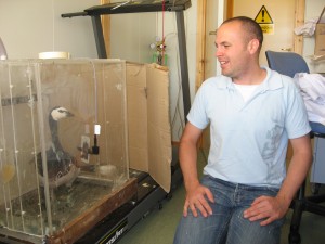 Steve Portugal next to his experimental setup