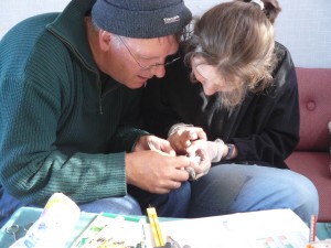 Maarten and Olga measuring and ringing a snowbunting